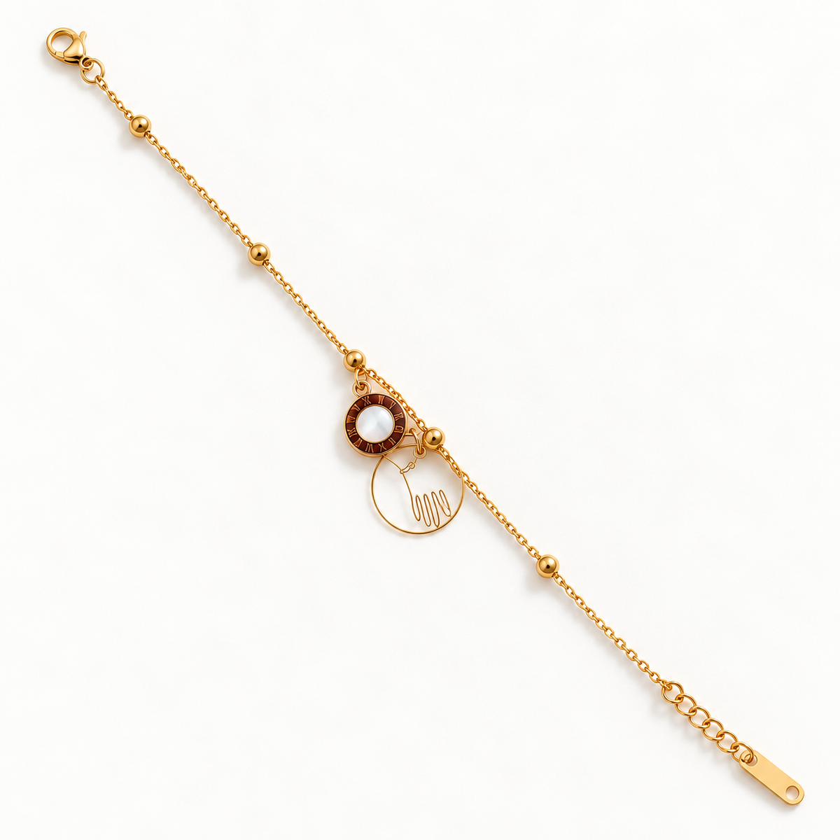 Fine gold-tone beaded bracelet with a white-centred round charm, an open circular hand-outline charm, lobster clasp and extension chain.